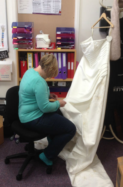 adjusting the wedding dress