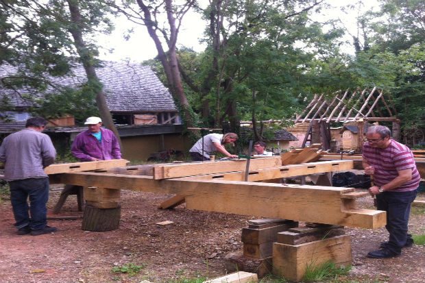 students working on timber frame for Long House