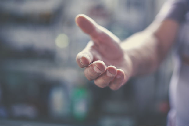 photo of an outstretched hand