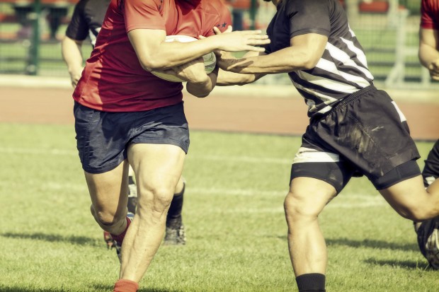 Men playing a game of rugby