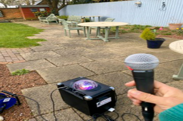 hand holding a karaoke microphone