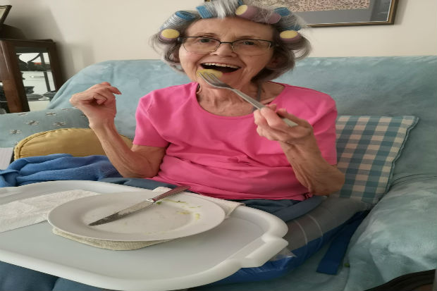 elderly lady finishing dinner