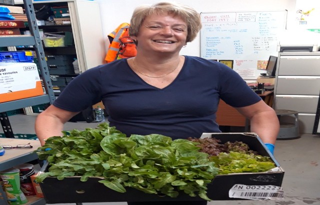 Sue with vegetables from our Foodbank 