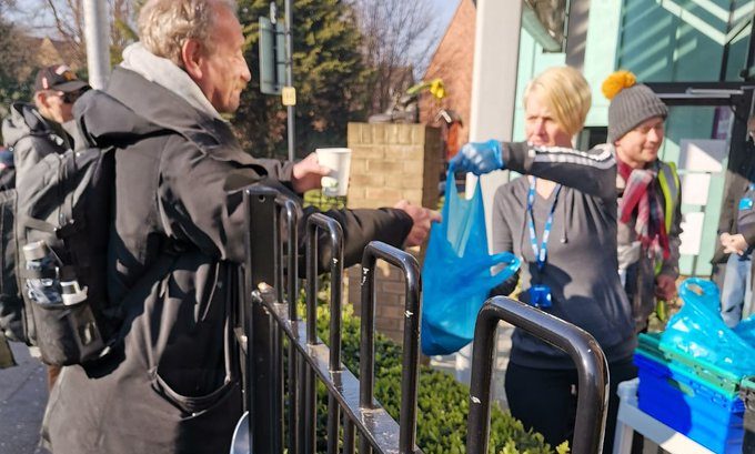 outside servery Hope Enterprises still feeding the homeless during the pandemic