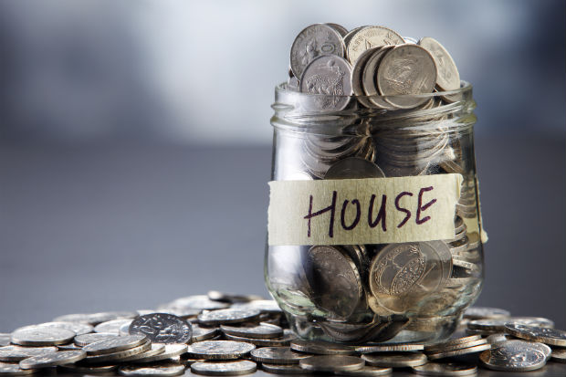 jar of coins labelled house