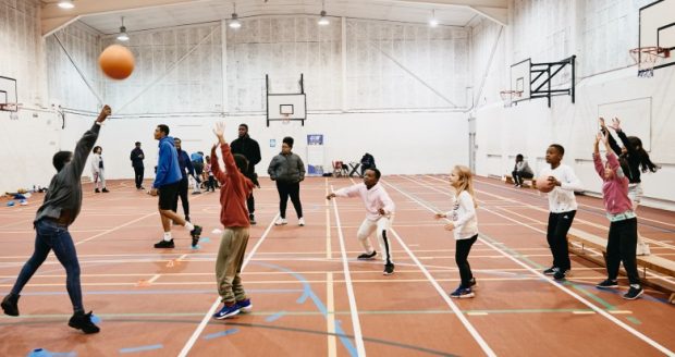 Group of young children taking part in Basketball training