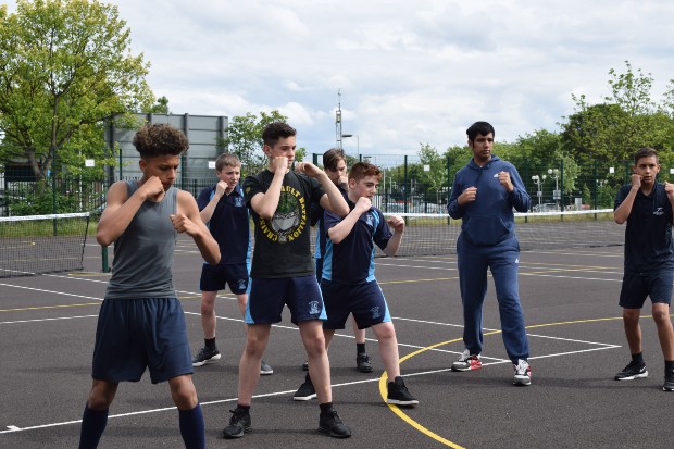 Kids being mentored in boxing